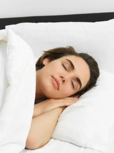 A woman sleeping peacefully after nightguard treatment at Clearbrook Advanced Dental Care in Cranbury, NJ
